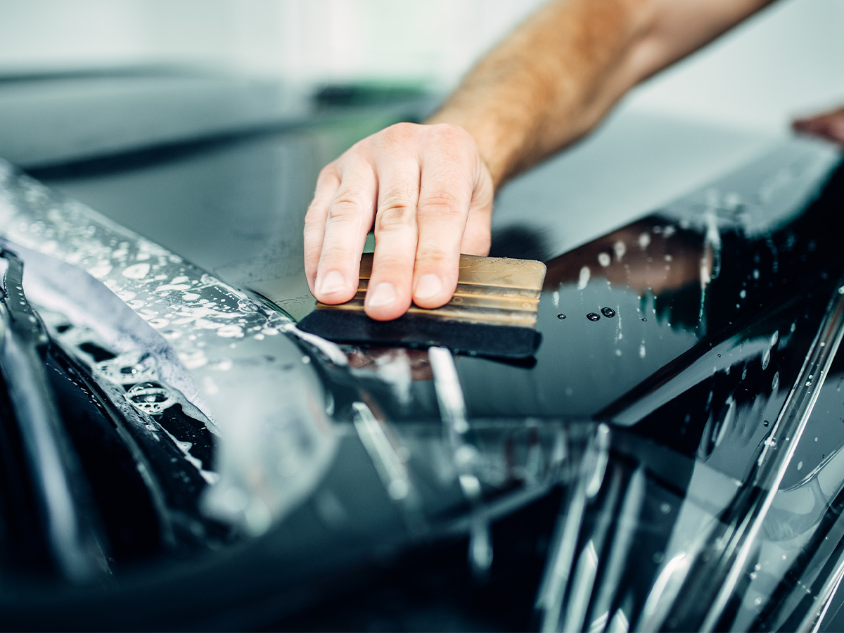Auto paint protection, transparent film closeup.